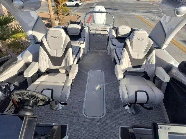 Slide: The Image of Luxurious interior of 2025 Avalon Excalibur Quad Lounge Windshield 27 FT boat, featuring plush seating. - 16