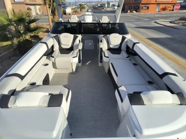 Slide: The Image of 2025 Avalon Excalibur Quad Lounge Windshield 27 FT boat with luxurious seating and modern design. - 7