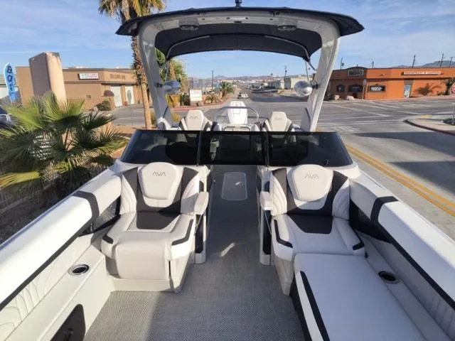 Slide: The Image of 2025 Avalon Excalibur Quad Lounge Windshield 27 FT boat with luxurious seating and modern design. - 8