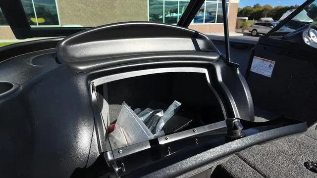 Slide: The Image of Open storage compartment in 2025 Lund 2075 Fisherman Sport boat. - 12