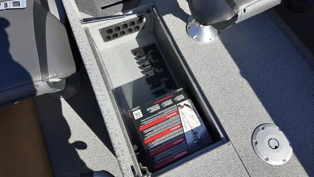 Slide: The Image of Storage compartment in 2025 Lund 2075 Fisherman Sport boat interior. - 13