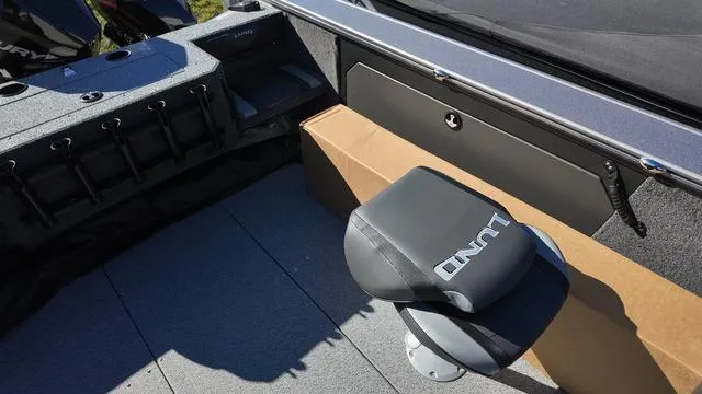 Slide: The Image of 2025 Lund 2075 Fisherman Sport boat interior with seating and storage compartments. - 14