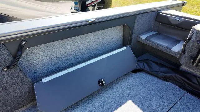 Slide: The Image of 2025 Lund 2075 Fisherman Sport interior with storage compartment and seating. - 15