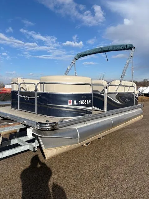 Slide: The Image of 2021 Quest le816 pontoon boat on trailer under blue sky. - 5