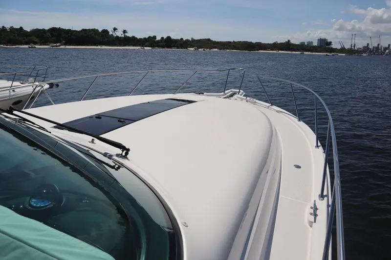 Slide: The Image of 2016 Tiara Yachts 4300 Open on calm water, showcasing sleek deck design. - 15