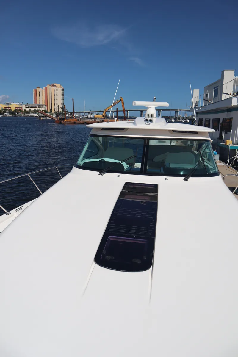 Slide: The Image of 2016 Tiara Yachts 4300 Open on water, cityscape in background. - 18