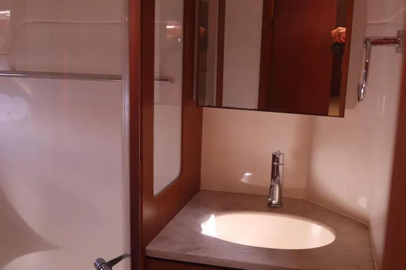 Slide: The Image of Bathroom interior of 2016 Tiara Yachts 4300 Open with modern sink and mirror. - 20
