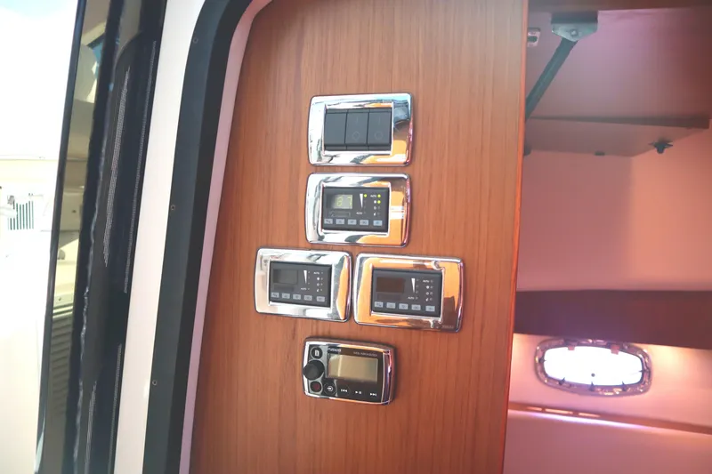 Slide: The Image of Control panel inside 2016 Tiara Yachts 4300 Open, featuring modern switches and displays. - 27