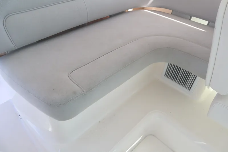 Slide: The Image of 2016 Tiara Yachts 4300 Open interior seating, featuring light gray upholstery. - 30