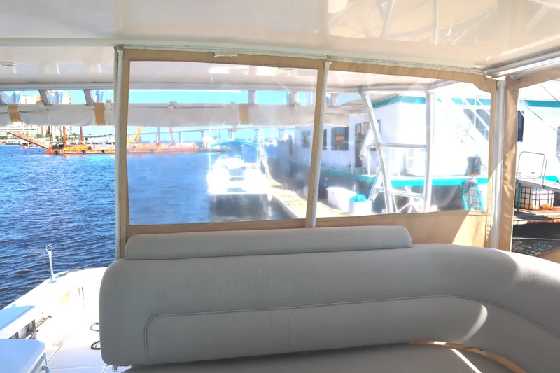 Slide: The Image of 2016 Tiara Yachts 4300 Open interior with marina view through windows. - 33