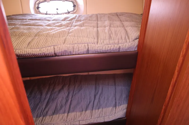 Slide: The Image of Interior cabin of 2016 Tiara Yachts 4300 Open with bunk beds. - 7
