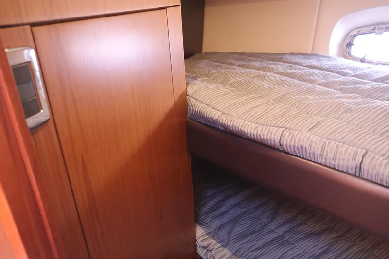 Slide: The Image of Cabin interior of 2016 Tiara Yachts 4300 Open with cozy bedding. - 8