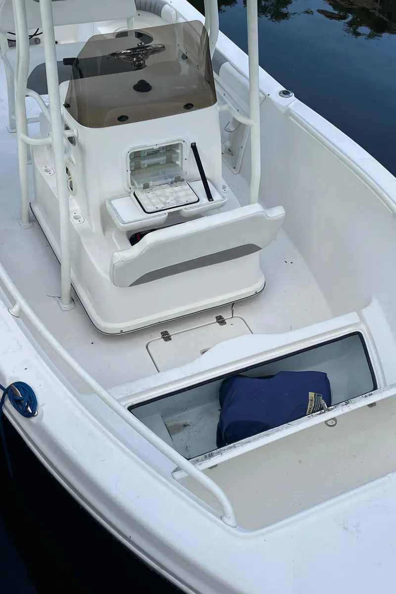 Slide: The Image of 2019 Polar 195CC boat interior with storage compartments and seating. - 4