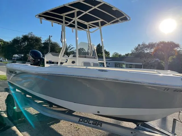 Slide: The Image of 2019 Polar 195CC boat on trailer under sunny sky. - 9