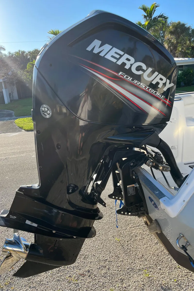 Slide: The Image of Mercury FourStroke outboard motor on 2019 Polar 195CC boat, parked outdoors. - 11