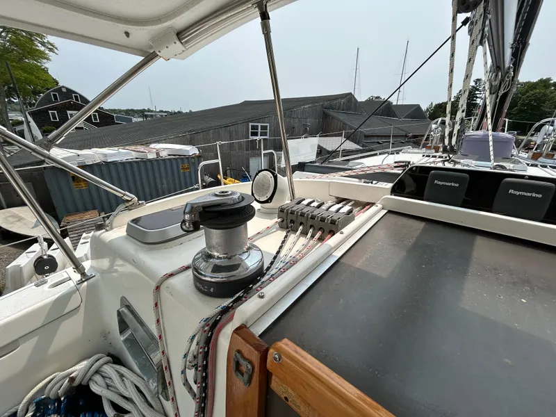 Slide: The Image of 1994 Freedom 45 Aft Cockpit sailboat deck with winch and control panel. - 12