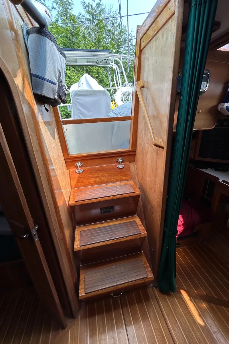 Slide: The Image of Wooden interior stairs on a 1994 Freedom 45 Aft Cockpit sailboat. - 26