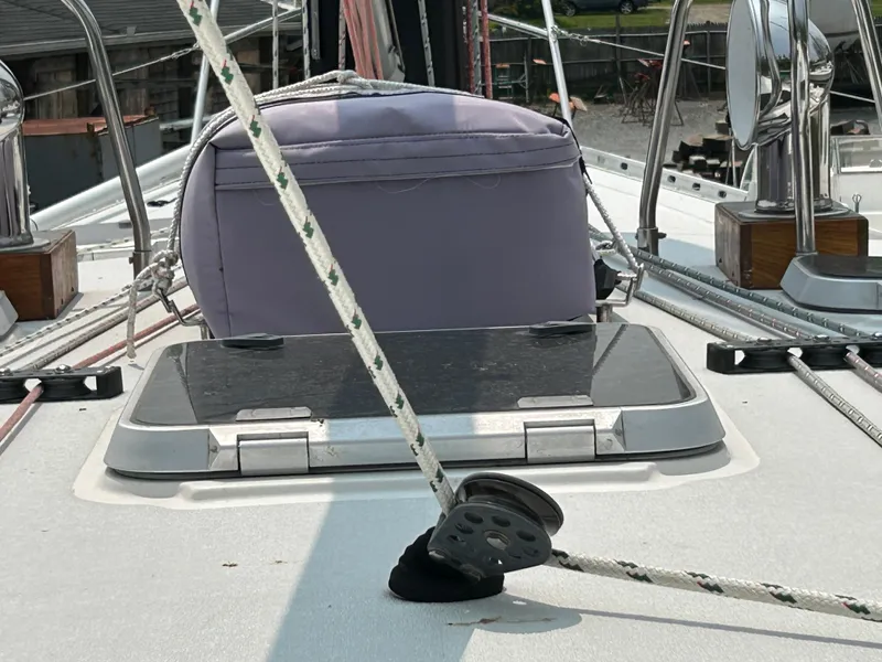 Slide: The Image of Deck view of a 1994 Freedom 45 Aft Cockpit sailboat with ropes and hatch. - 9