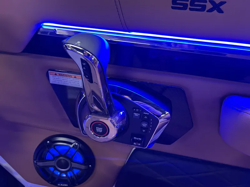 Slide: The Image of Interior of 2025 Chaparral 267 SSX boat with illuminated controls and speaker. - 22