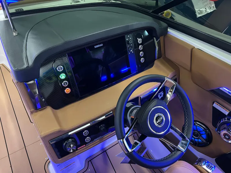Slide: The Image of 2025 Chaparral 267 SSX dashboard with modern steering and digital controls. - 23