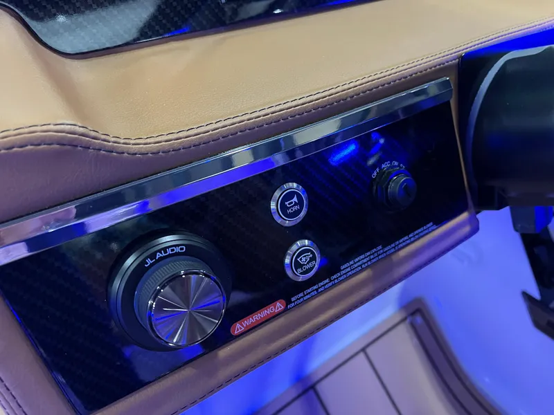 Slide: The Image of Control panel of 2025 Chaparral 267 SSX boat with JL Audio system. - 24