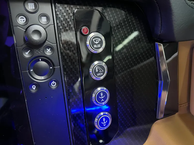 Slide: The Image of Control panel of 2025 Chaparral 267 SSX boat with carbon fiber finish. - 27