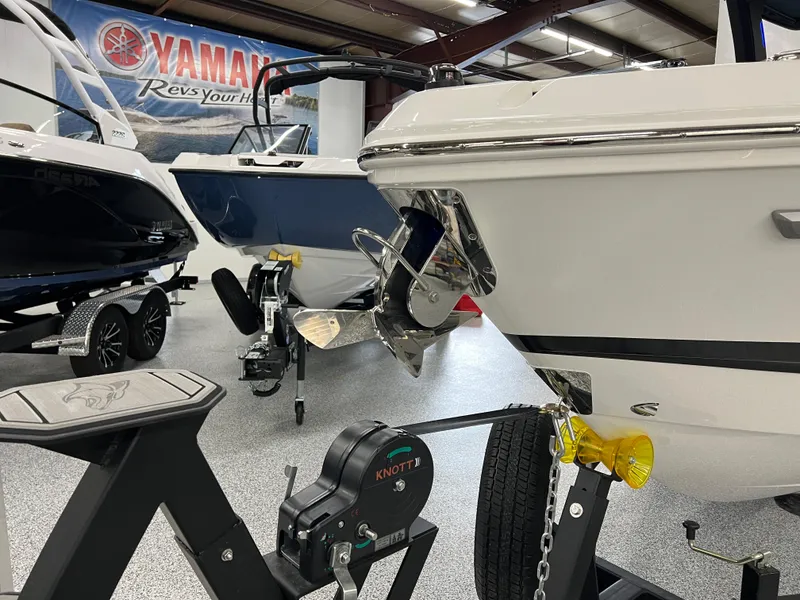 Slide: The Image of 2025 Chaparral 267 SSX boat in showroom, featuring sleek design and Yamaha branding. - 3