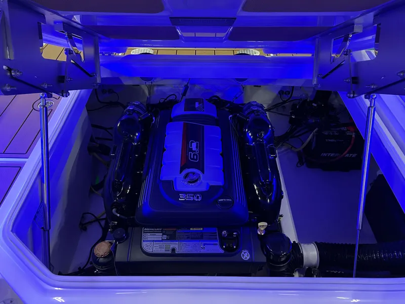 Slide: The Image of Engine compartment of 2025 Chaparral 267 SSX with blue lighting. - 36