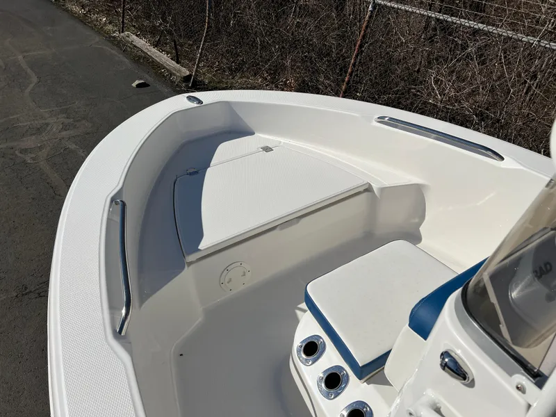 Slide: The Image of 2025 Robalo R160 Center Console boat interior with seating and storage. - 11