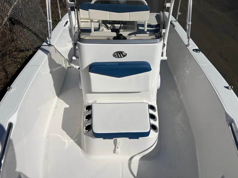Slide: The Image of 2025 Robalo R160 Center Console boat interior with seating and console view. - 16