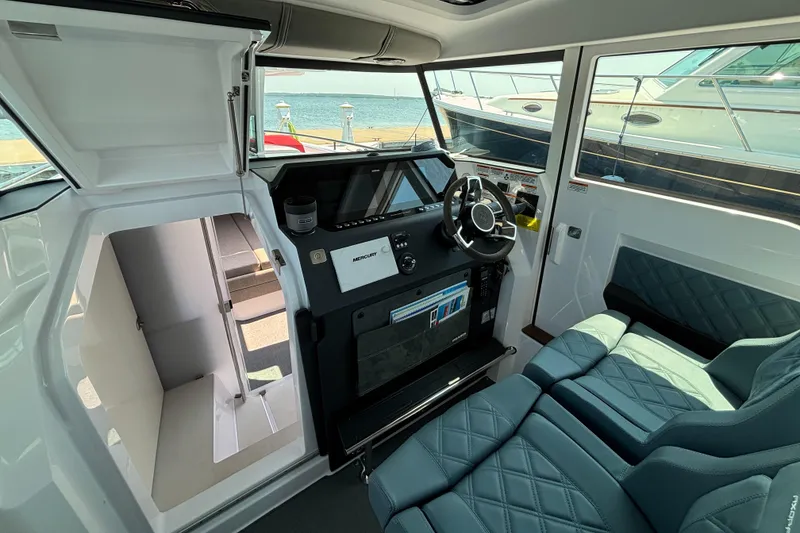 Slide: The Image of Interior of 2022 Axopar 37XC boat with modern helm and seating. - 10