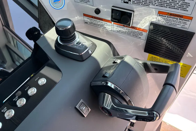 Slide: The Image of Control panel of 2022 Axopar 37XC boat with joystick and throttle. - 14