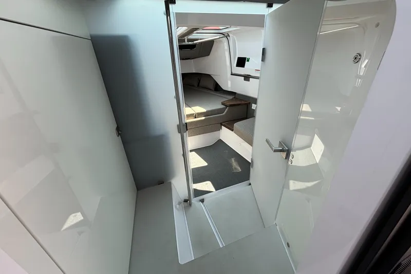 Slide: The Image of Interior view of 2022 Axopar 37XC cabin, featuring modern design and comfortable seating. - 21