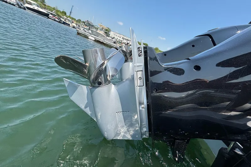 Slide: The Image of Outboard motor of 2022 Axopar 37XC boat in marina waters. - 30