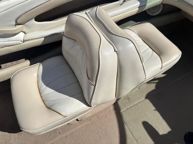 Slide: The Image of 1997 Sea Ray 210 Bowrider boat seats, beige leather upholstery, interior view. - 6