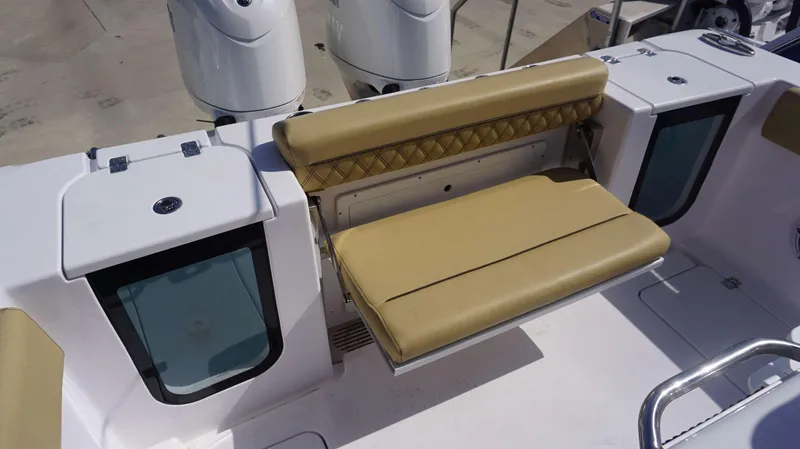 Slide: The Image of 2025 Sportsman 262 Open boat with tan seating and dual outboard motors. - 11
