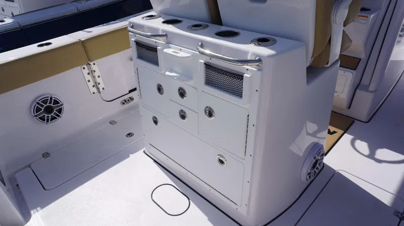 Slide: The Image of 2025 Sportsman 262 Open boat interior with storage compartments and cup holders. - 12