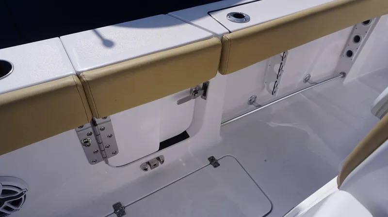 Slide: The Image of 2025 Sportsman 262 Open boat interior with tan seating and stainless steel fixtures. - 14