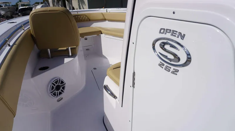 Slide: The Image of 2025 Sportsman 262 Open boat interior with tan seating and speaker. - 15