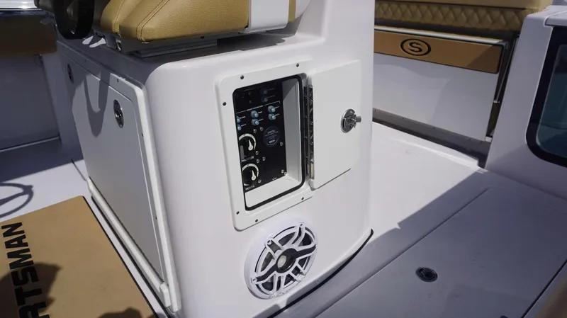 Slide: The Image of 2025 Sportsman 262 Open boat console with control panel and speaker. - 17