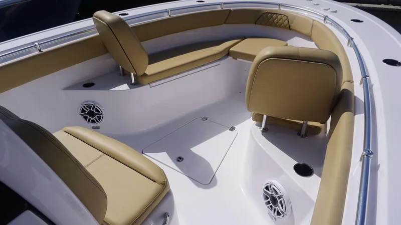 Slide: The Image of 2025 Sportsman 262 Open boat interior with tan seating and speakers. - 5