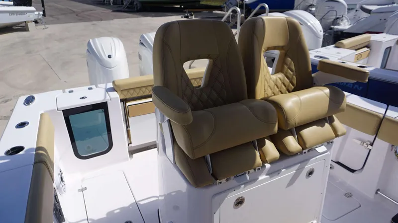 Slide: The Image of 2025 Sportsman 262 Open boat with tan leather seats and modern design. - 6