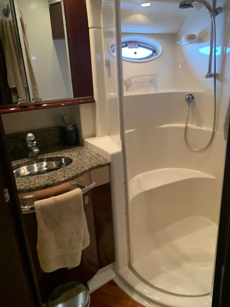 Slide: The Image of Luxurious bathroom in 2006 Sea Ray 52 Sedan Bridge yacht with shower and sink. - 11