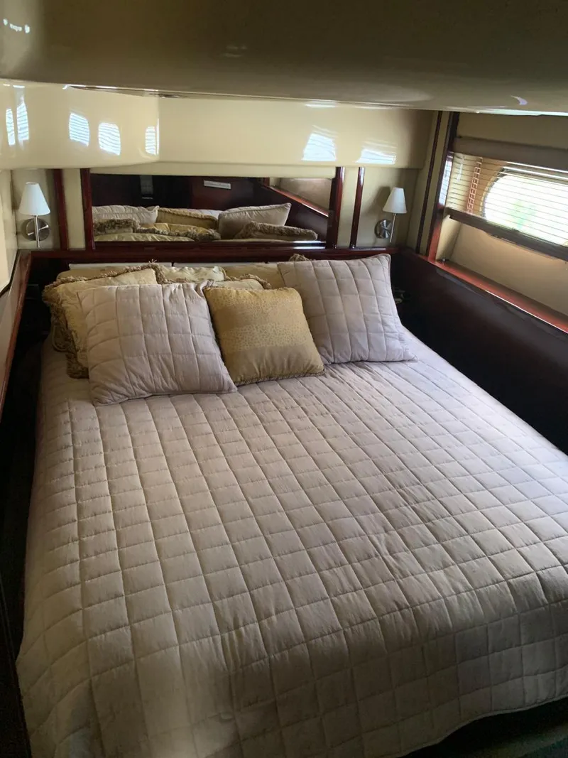 Slide: The Image of Luxurious bedroom interior of 2006 Sea Ray 52 Sedan Bridge yacht. - 14