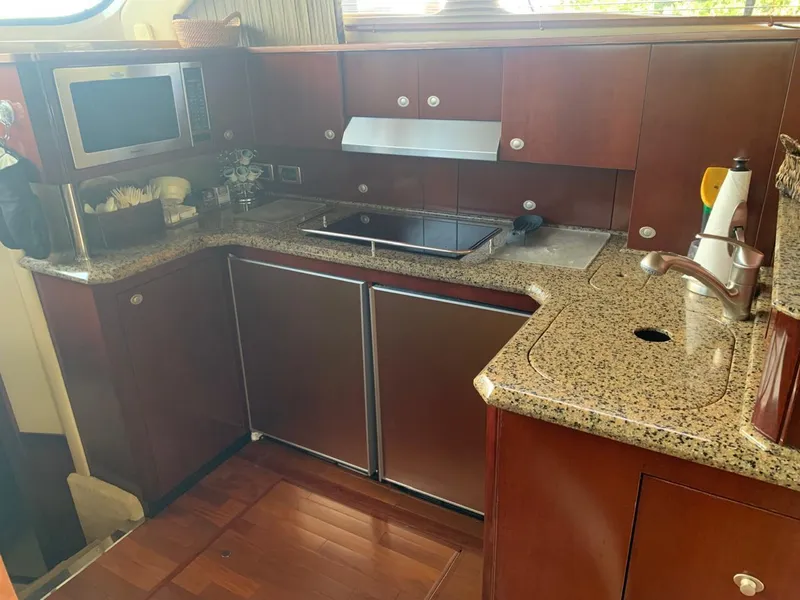 Slide: The Image of Luxurious kitchen interior of 2006 Sea Ray 52 Sedan Bridge yacht. - 19