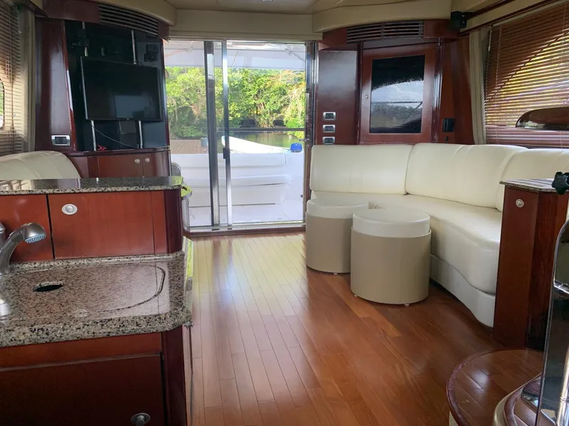 Slide: The Image of Luxurious interior of 2006 Sea Ray 52 Sedan Bridge yacht with modern furnishings. - 9
