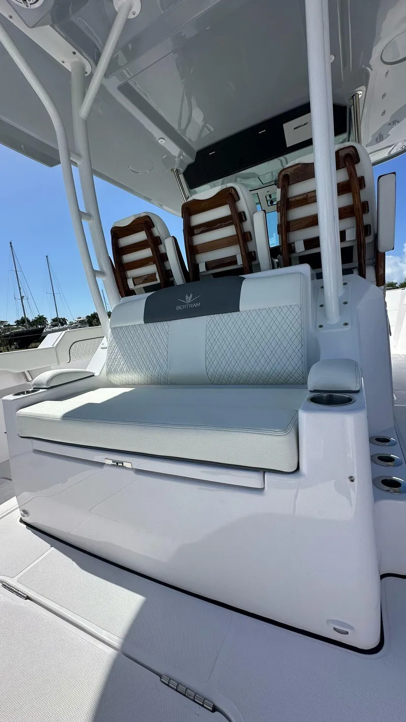 Slide: The Image of 2025 Bertram 34 CC boat interior with sleek seating and modern design. - 10