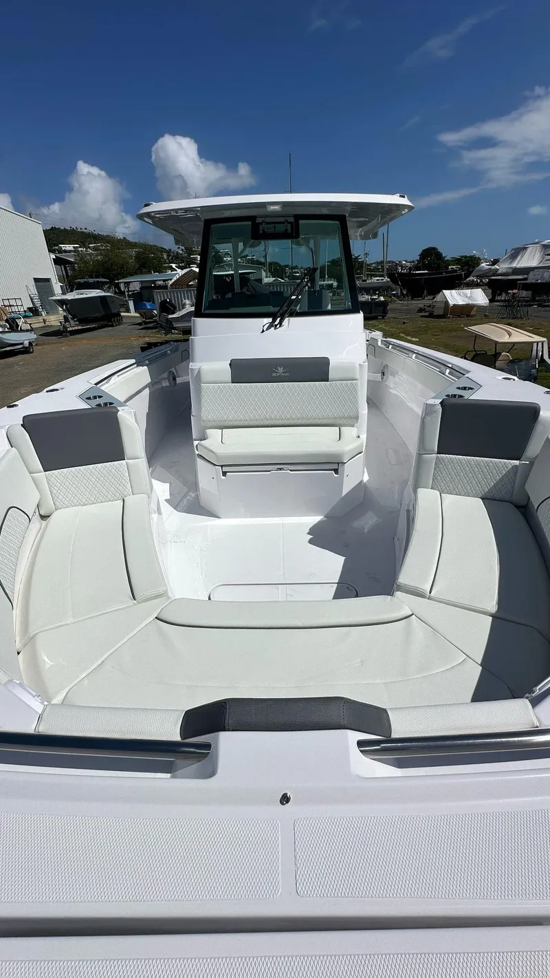 Slide: The Image of 2025 Bertram 34 CC boat with spacious seating and modern design. - 6