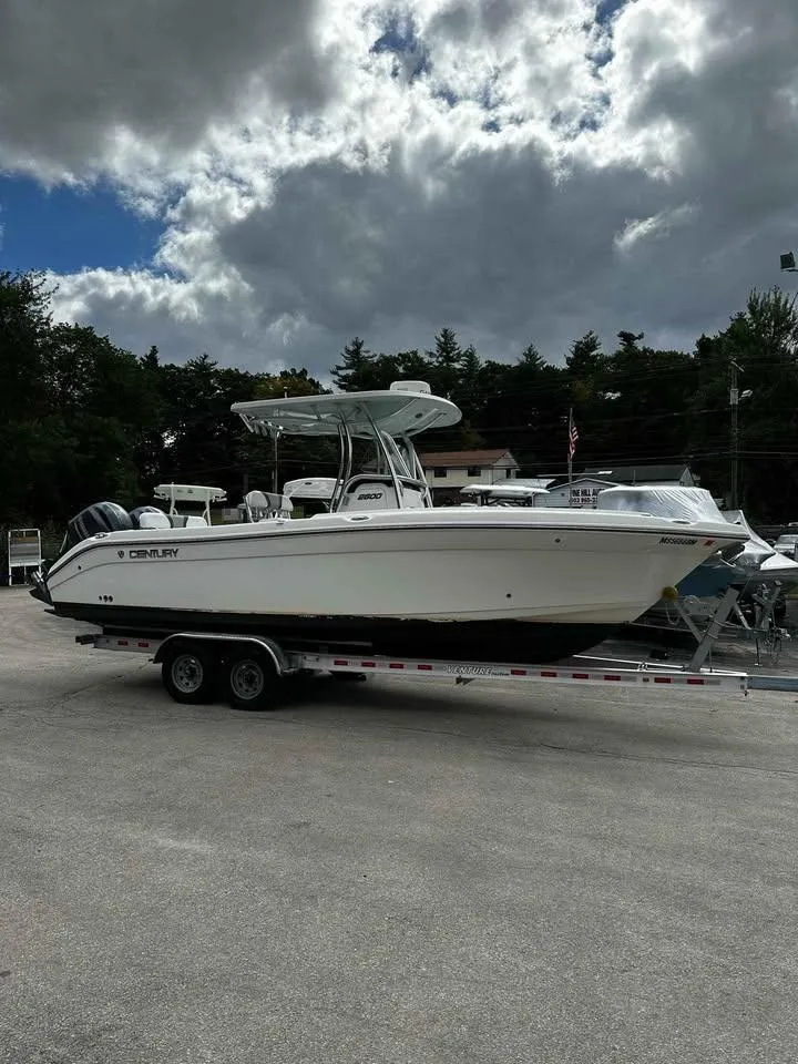 Slide: The Image of 2015 Century 2600 CC boat on trailer under cloudy sky. - 0