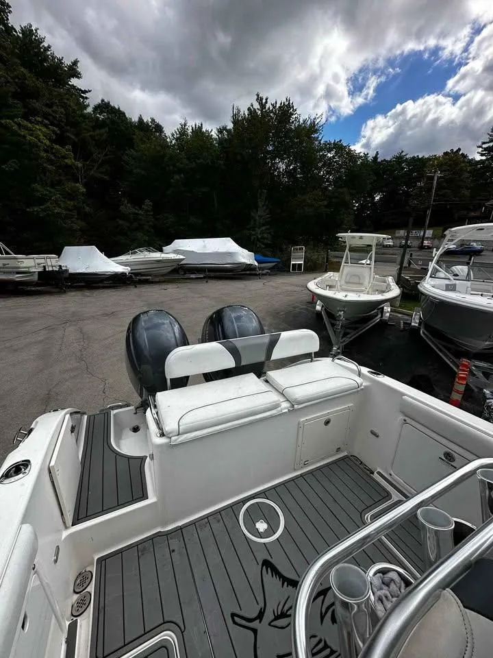 Slide: The Image of 2015 Century 2600 CC boat with dual engines, docked under cloudy skies. - 8